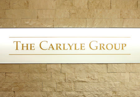 The logo of the Carlyle Group is displayed at the company's office in Tokyo, Japan October 17, 2018. REUTERS/Issei Kato/Files