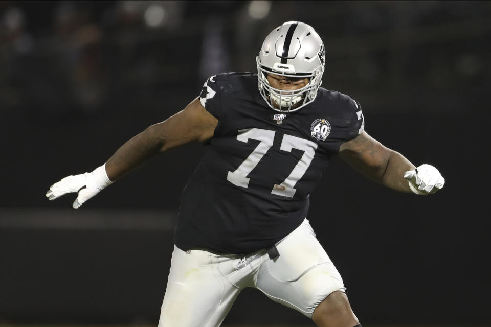 FILE - In this Sept. 9, 2019, file photo, Oakland Raiders offensive tackle Trent Brown (77) protects a gap in the offensive line during an NFL football game against the Denver Broncos, in Oakland, Calif. Las Vegas Raiders general manager Mike Mayock says the “jury is still out” on whether highly paid right tackle Trent Brown will be back in 2021 after being limited by injuries in his first two seasons with the team. (AP Photo/Peter Joneleit, File)