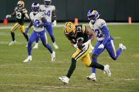 Green Bay Packers' Allen Lazard breaks away from Los Angeles Rams' Jordan Fuller (32) to score on a 58-yard touchdown run during the second half of an NFL divisional playoff football game Saturday, Jan. 16, 2021, in Green Bay, Wis. (AP Photo/Morry Gash)