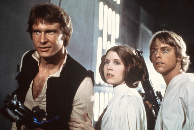 (l-r) harrison ford, carrie fisher and mark hamil in star wars: a new hope.