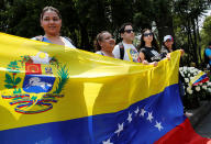 <p>People hold a Venezuela flag as they take part in a protest held by Venezuelans in Mexico against Venezuela’s Constituent Assembly election, at the Heroic Children monument in Mexico City, Mexico July 30, 2017. (Henry Romero/Reuters) </p>