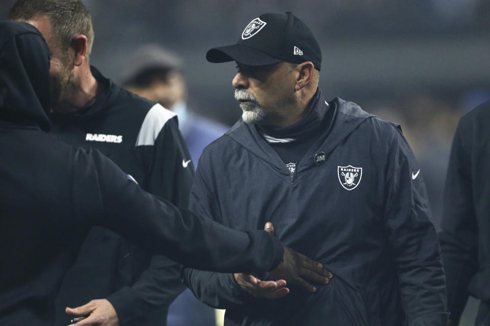 Las Vegas Raiders interim head coach Rich Bisaccia walks off the field after the Las Vegas Raiders defeated the Los Angeles Chargers in overtime of an NFL football game, Sunday, Jan. 9, 2022, in Las Vegas. (AP Photo/Ellen Schmidt)