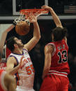 CHICAGO, IL - MARCH 12: Joakim Noah #13 of the Chicago Bulls dunks the ball against Josh Harrelison #55 of the New York Knicks at the United Center on March 12, 2012 in Chicago, Illinois. NOTE TO USER: User expressly acknowledges and agrees that, by downloading and or using this photograph, User is consenting to the terms and conditions of the Getty Images License Agreement. (Photo by Jonathan Daniel/Getty Images)