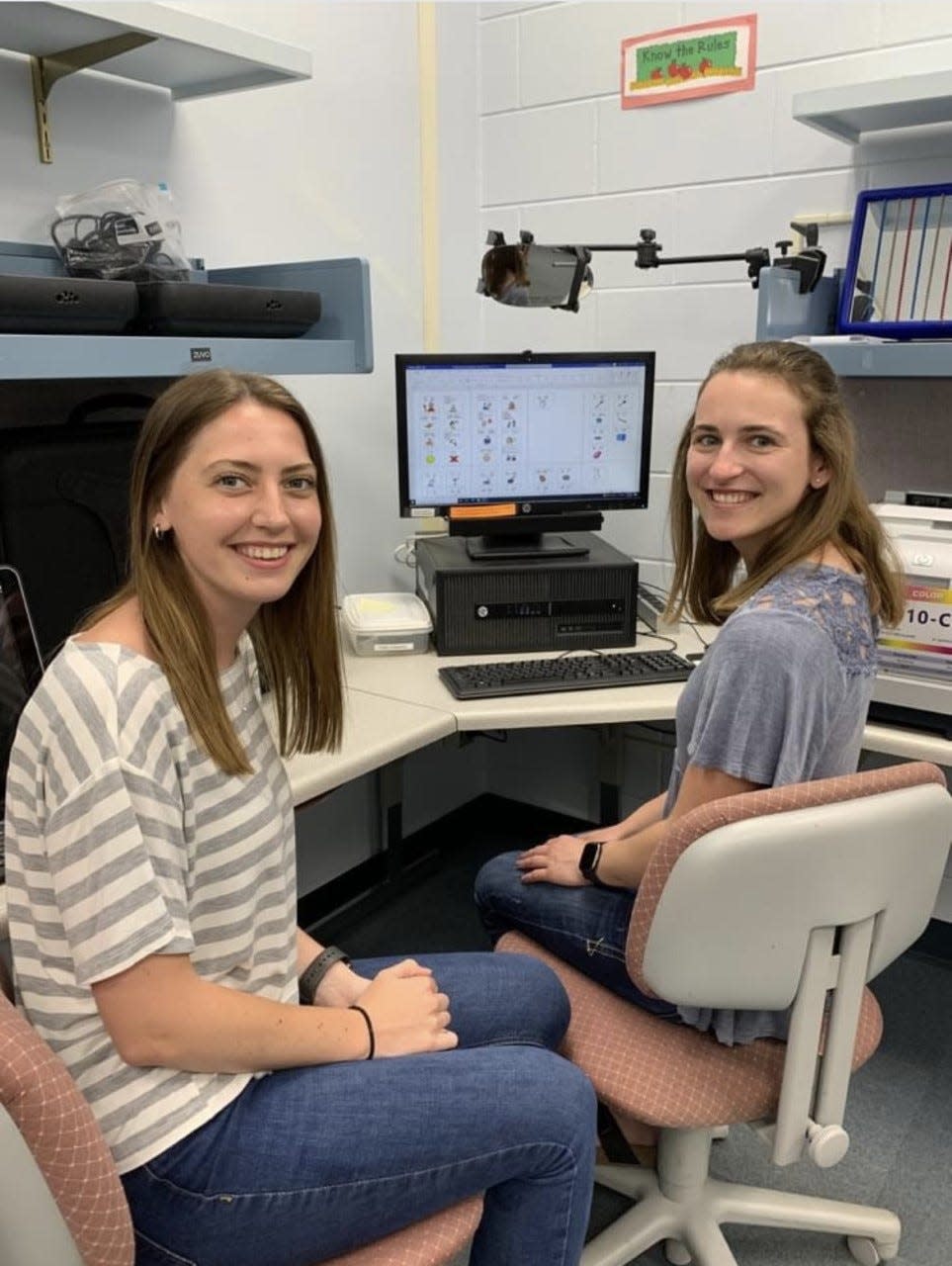 Breanna Wolter (left) and Morgan Knutson (right) work on the refugee dictionary in spring 2022 in the University of Wisconsin Stevens Point Speech, Language and Hearing Clinic.