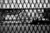 <p>Welcome signs are obscured by security fencing along the perimeter of the Republican National Convention Monday in Cleveland. (Photo: Khue Bui for Yahoo News)</p>