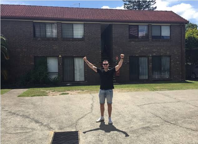Eddie Dilleen standing in front of one of his apartments.