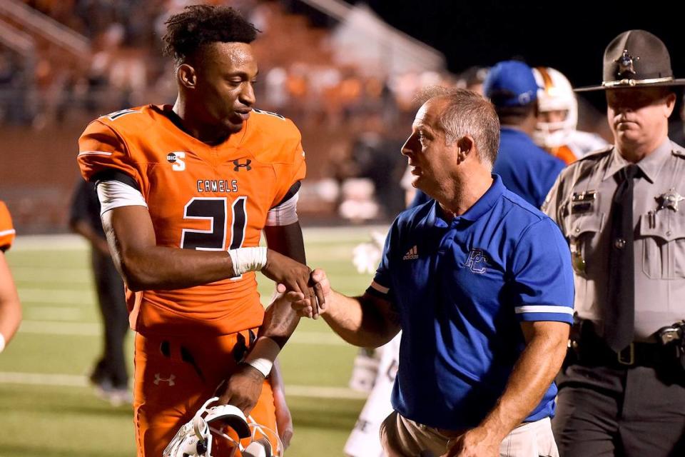 Presbyterian head football coach Kevin Kelly congratulates Campbell running back Michael Jamerson (21) after their victory.r The Presbyterian Blue Hose and the Campbell Fighting Camels met in a non-conference football game in Buies Creek, N.C. on September 18, 2021.