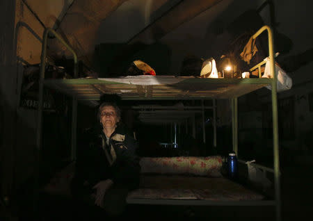 A woman sits in a basement used as a shelter from artillery fire in Donetsk, September 3, 2014. REUTERS/Maxim Shemetov