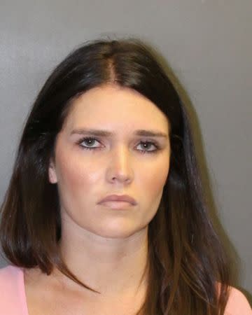 Cerissa Laura Riley, 31, appears in a booking photo provided by the Newport Beach Police Department September 19, 2018. Newport Beach Police Department/Handout via REUTERS