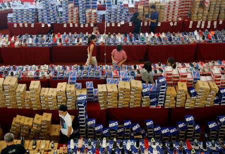 People shop for shoes at a mall in Malaysia's southern city of Johor Bahru April 25, 2017. REUTERS/Edgar Su