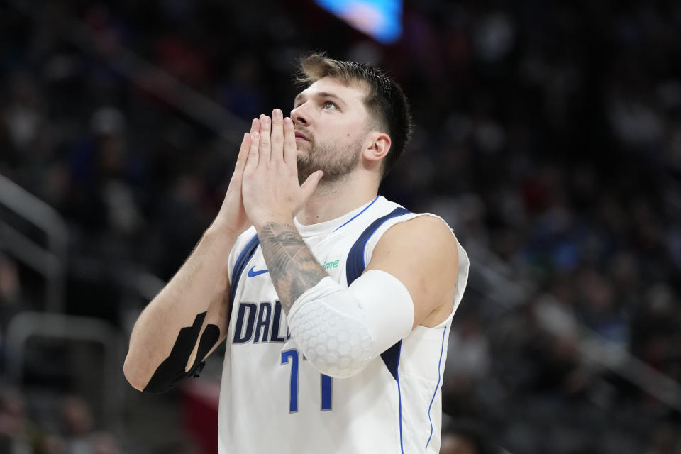 Dallas Mavericks guard Luka Doncic looks skyward after a shot during the second half of an NBA basketball game against the Detroit Pistons, Saturday, March 9, 2024, in Detroit. (AP Photo/Carlos Osorio)