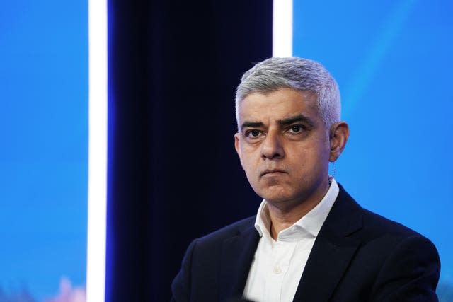 London Mayor Sadiq Khan against blue backdrop