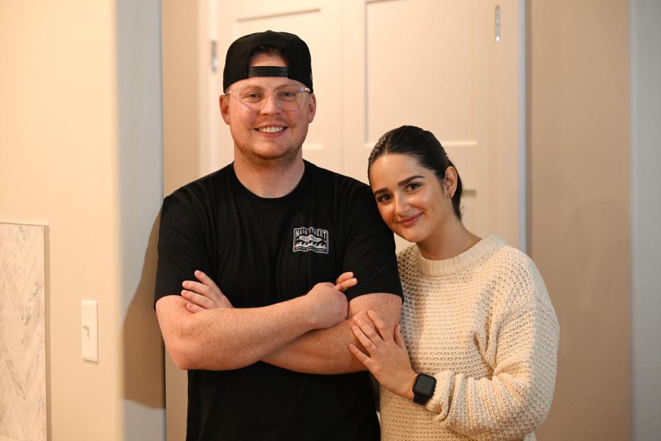 Zach and Kaitlyn Gordon pose for a photo in their new home in Spanish Fork on Tuesday, Nov. 21, 2023. | Scott G Winterton, Deseret News