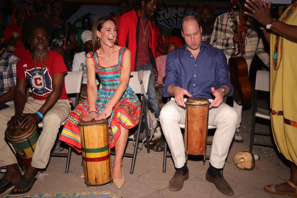 The couple play music during a visit to the former home of musician Bob Marley in Kingston (PA)