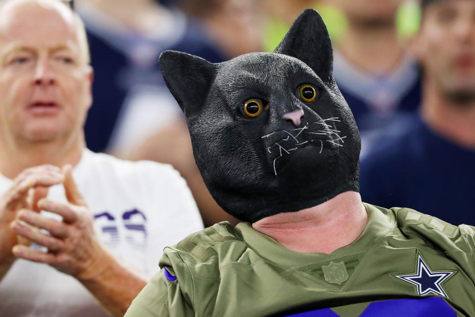 ARLINGTON, TEXAS - NOVEMBER 10: A fan wearing a black cat mask attends the game between the Minnesota Vikings and the Dallas Cowboys at AT&T Stadium on November 10, 2019 in Arlington, Texas. (Photo by Tom Pennington/Getty Images)