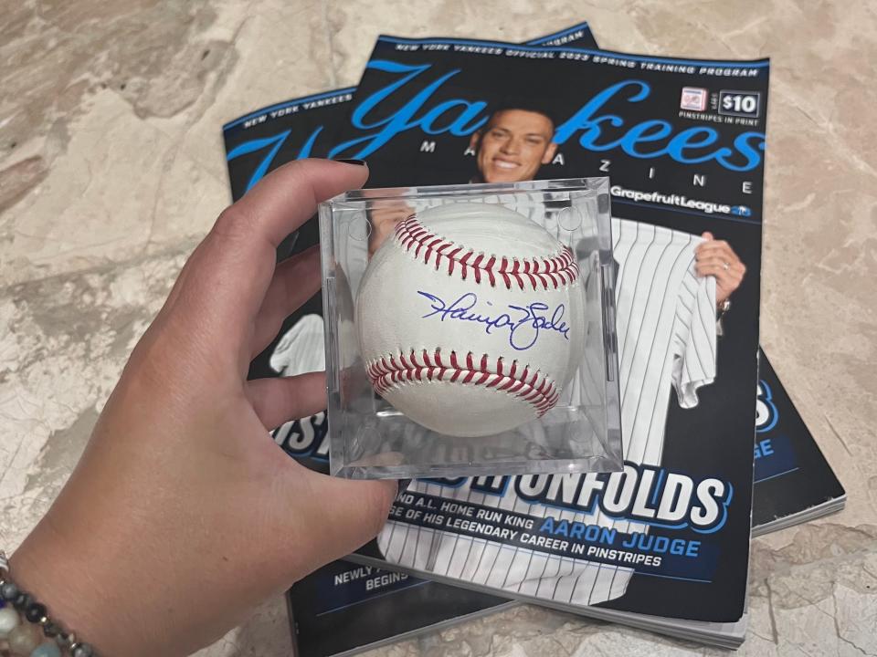 A baseball signed by Harrison Bader, Lucia Bailey, "I Drained My Savings For The Yankee Inside Experience and It Was a Huge Disappointment. "