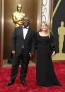 Steve McQueen, best director nominee for his film "12 Years a Slave," and partner Bianca Stigter arrive at the 86th Academy Awards in Hollywood, California March 2, 2014. REUTERS/Lucas Jackson (UNITED STATES TAGS: ENTERTAINMENT) (OSCARS-ARRIVALS)