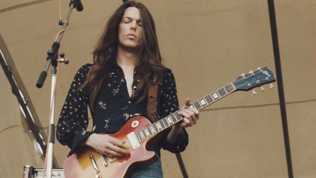  American guitarist Scott Gorham performs playing a Gibson Les Paul guitar on stage with Irish rock group Thin Lizzy at the Reading Festival, 24th August 1974. 