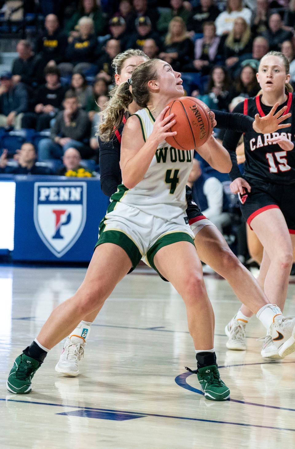 Archbishop Wood's Ava Renninger (4) goes for a lay-up against Archbishop Carroll in the Philadelphia Catholic League girls basketball championship game in Philadelphia on Monday, Feb. 26, 2024.