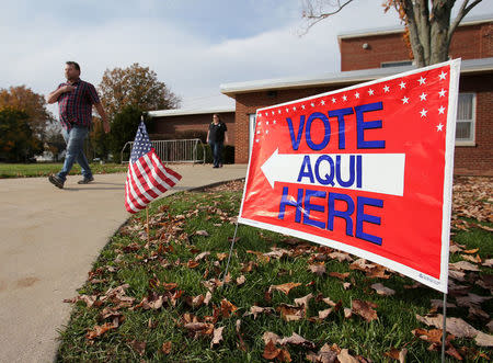 FILE PHOTO: Voters leave a polling station after casting their votes during the U.S. presidential election in Olmsted Falls, Ohio, U.S. on November 8, 2016. REUTERS/Aaron Josefczyk/File Photo