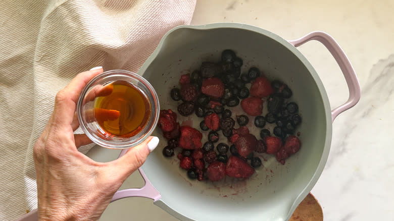 adding maple syrup to pot