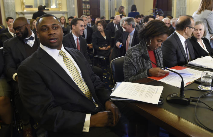 Executive Vice President of Football Operations for the NFL Troy Vincent, left, sits at the witness table on Capitol Hill in Washington, D.C., on Tuesday, December  2, 2014, during testimony before the Senate Commerce Committee hearing on domestic violence in professional sports. Sen. Jay Rockefeller, the West Virginia Democrat who chairs the panel, says he called for Tuesday's hearing because until very recently, the leagues' records have not been very good on the issue. Seated to the right of Vincent are Deputy Managing Director for the National Football League Players' Association Teri Patterson, Executive Vice President of Baseball Operations for Major League Baseball Joe Torre, and Counsel for the Major League Baseball Players Association Virginia Seitz. (AP Photo/Susan Walsh)