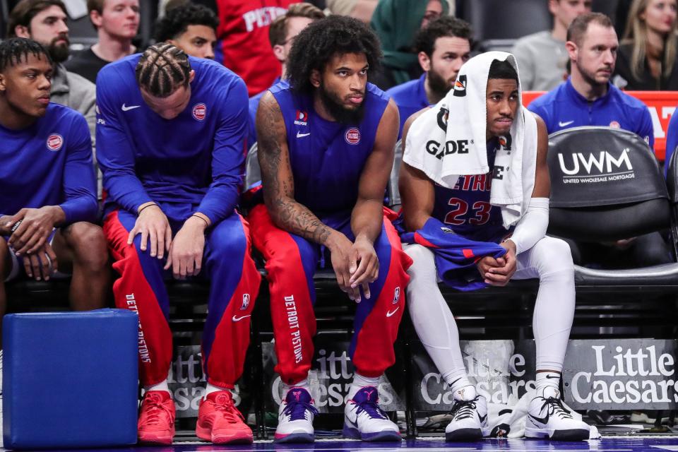 Left to right: Pistons guard Marcus Sasser, forward Kevin Knox II, center Marvin Bagley III and guard Jaden Ivey watch the final seconds of the 116-102 loss to the Memphis Grizzlies, Dec. 6, 2023 at Little Caesars Arena.