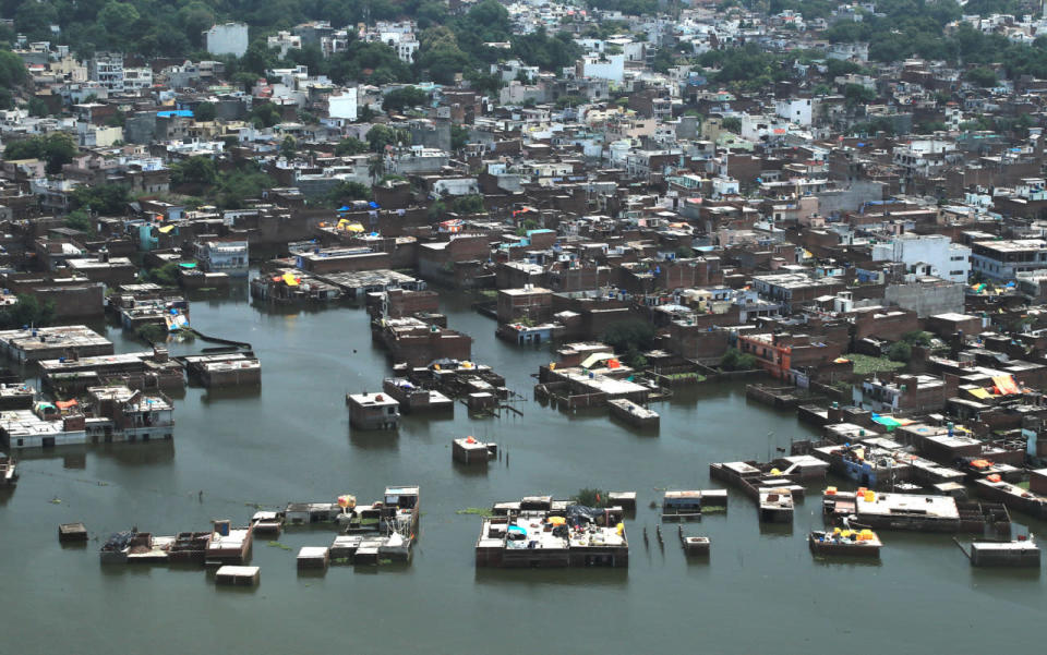 <p>Residential areas are seen marooned in the river Ganges flood waters in Allahabad, India, Friday, Aug. 26, 2016. (AP Photo/Rajesh Kumar Singh)</p>