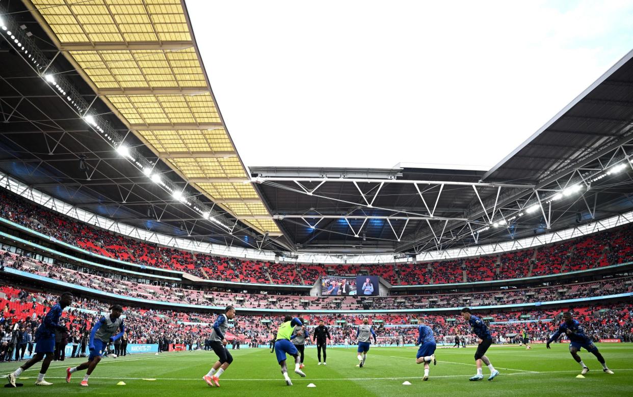 Chelsea players warm up ahead of the match