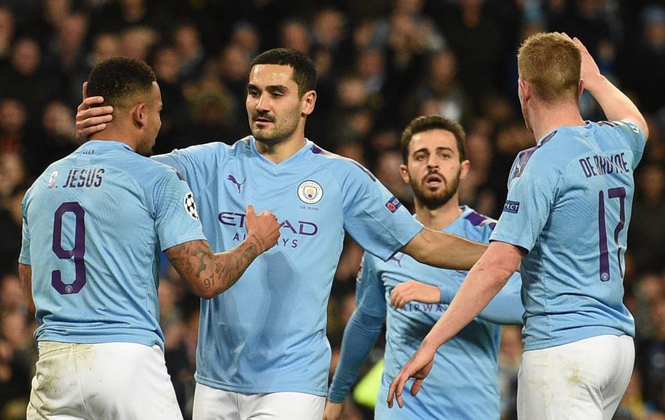 Manchester City's German midfielder Ilkay Gundogan (2L) celebrates scoring the opening goal during the UEFA Champions League football Group C match between Manchester City and Shakhtar Donetsk at the Etihad Stadium in Manchester, north west England on November 26, 2019. (Photo by Oli SCARFF / AFP) (Photo by OLI SCARFF/AFP via Getty Images)