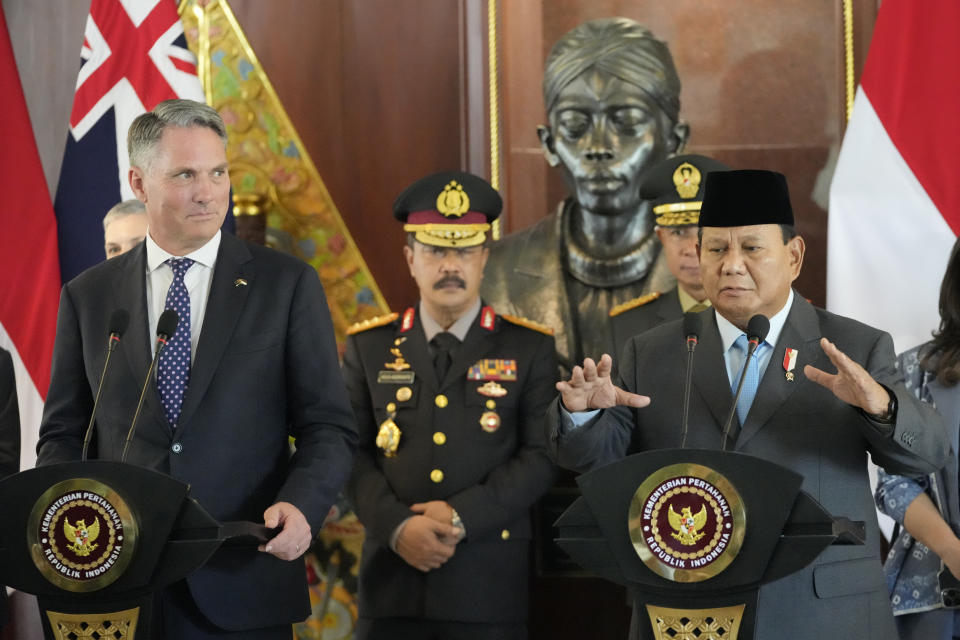 Indonesian Defense Minister Prabowo Subianto, right, gestures as he speaks during a joint press conference with Australian Deputy Prime Minister and Defense Minister Richard Marles, left, following their meeting in Jakarta, Indonesia, Friday, Feb. 23, 2024. (AP Photo/Achmad Ibrahim)