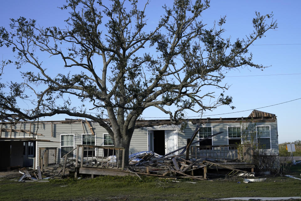 A destroyed home is seen in the aftermath of both Hurricane Laura and Hurricane Delta, in Grand Lake, La., Friday, Dec. 4, 2020. (AP Photo/Gerald Herbert)