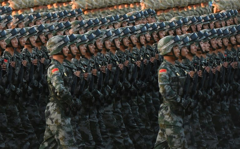 Chinese soldiers conduct a practice at dawn ahead of a military parade in Beijing's Tiananmen Square on September 3, 2015