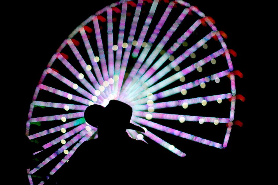 A man stands after a concert at the Oklahoma State Fair in Oklahoma City, Thursday, Sept. 16, 2021.