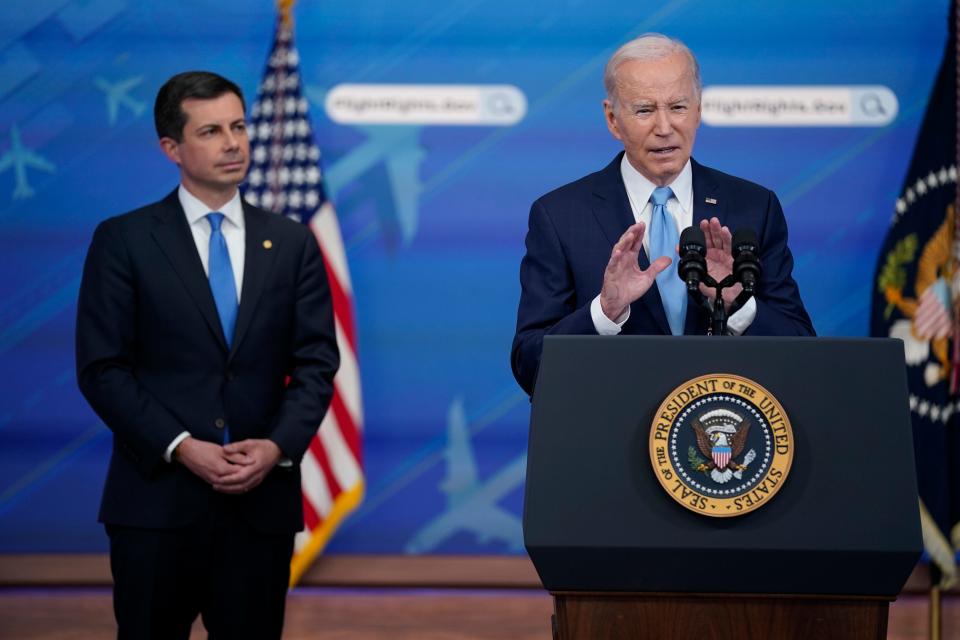 Transportation Secretary Pete Buttigieg listens as President Joe Biden delivers remarks on requiring airlines to compensate passengers for extensive flight delays and cancellations in the South Court Auditorium on the White House complex, Monday, May 8, 2023, in Washington. (AP Photo/Evan Vucci) ORG XMIT: DCEV416
