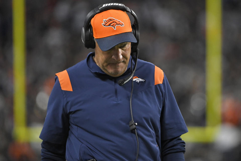 Denver Broncos head coach Vic Fangio walks along the sidelines during the second half of an NFL football game against the Las Vegas Raiders, Sunday, Dec. 26, 2021, in Las Vegas. (AP Photo/David Becker)
