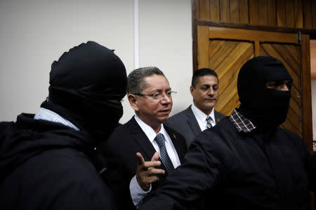 El Salvador's Attorney General Douglas Melendez talks with the media as he leaves a news conference in San Salvador, El Salvador October 16, 2018. REUTERS/Jose Cabezas/Files