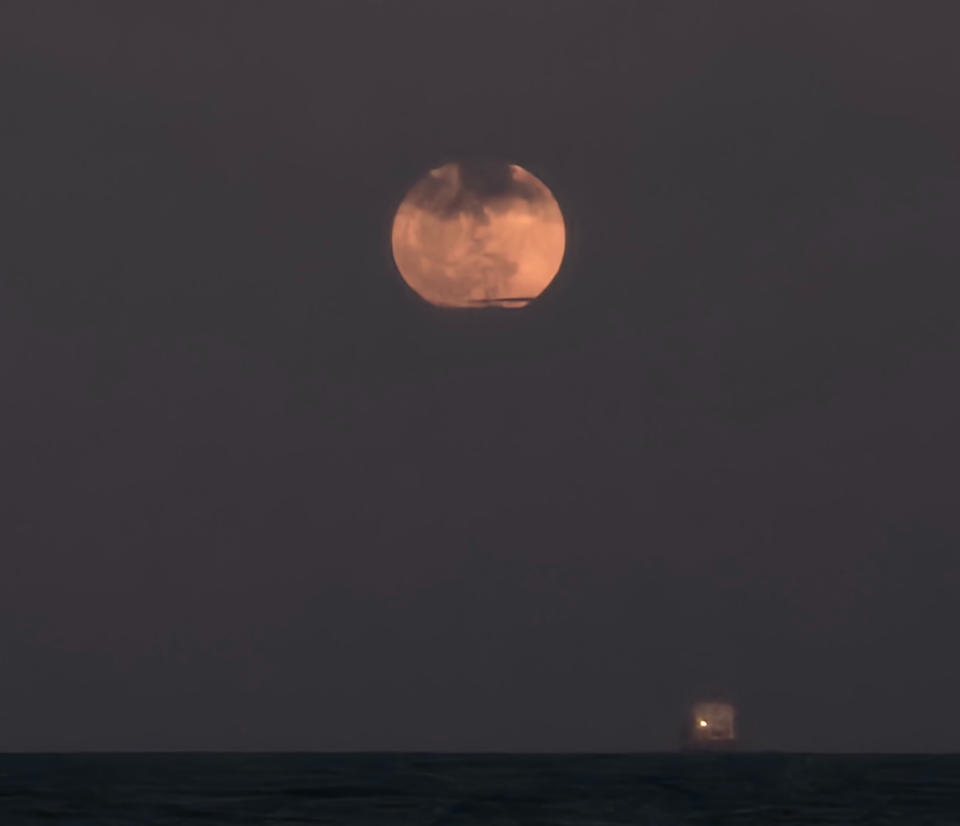 The full Strawberry Moon of June 2024 shines over Fort Lauderdale Beach, Florida, despite cloudy skies, in this photo by Lisa Shislowski on June 21, 2024.