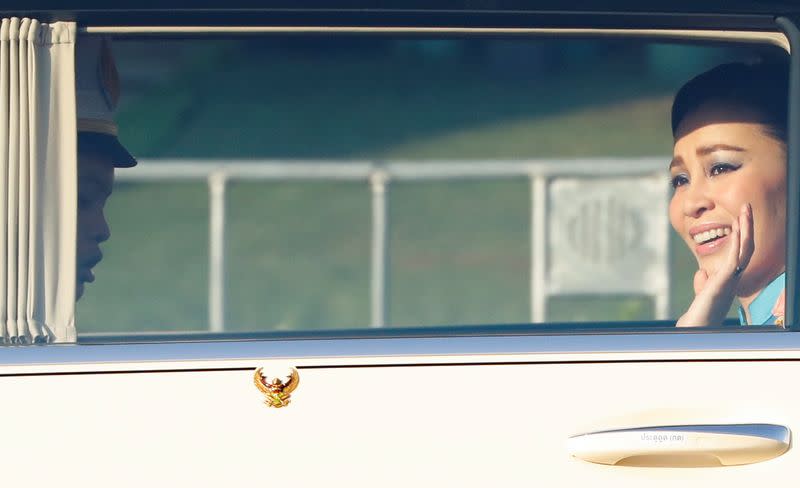 Thailand's Queen Suthida is pictured as the motorcade drives towards the Grand Palace in Bangkok