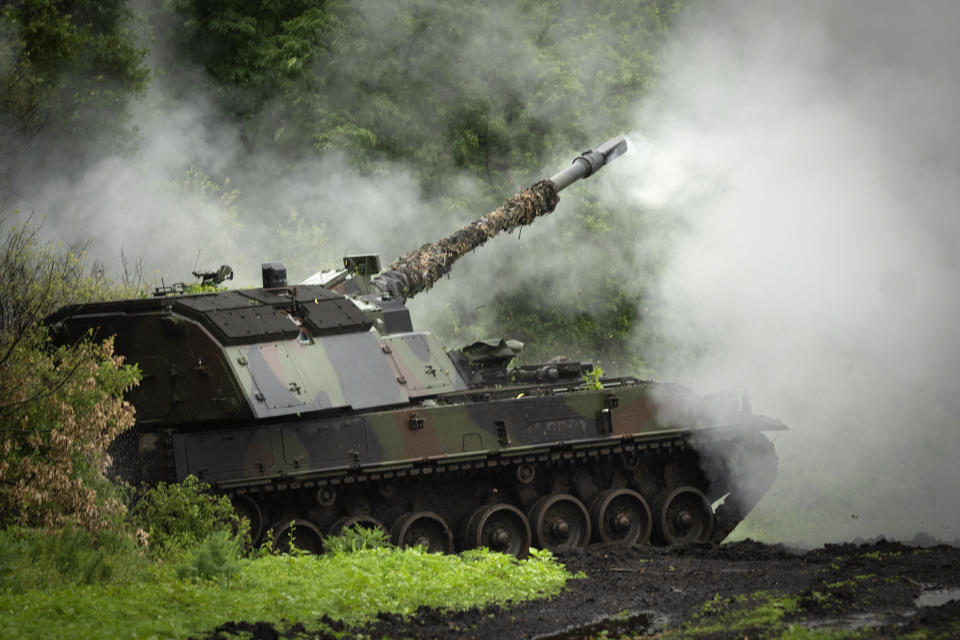 A Ukrainian army, German self-propelled Panzerhaubitze 2000 artillery fires toward Russian positions at the frontline near Bakhmut, Donetsk region, Ukraine, Saturday, May 27, 2023. (AP Photo/Efrem Lukatsky)