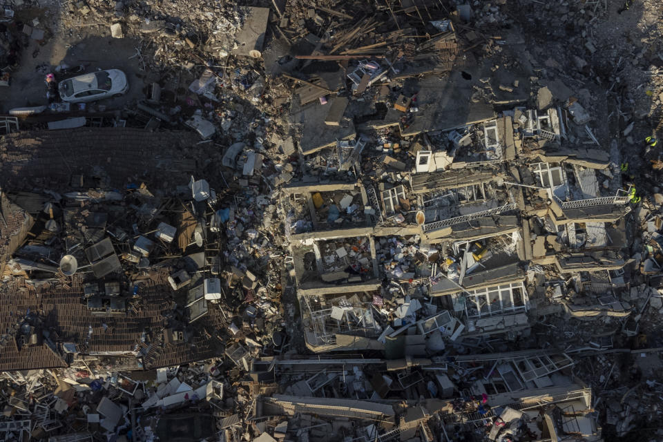 An aerial view of collapsed buildings in Antakya, southeastern Turkey, Saturday, Feb. 11, 2023. (AP Photo/Bernat Armangue)