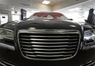 A Chrysler 300 sits in the showroom at Bill Snethkamp dealership in Detroit, Michigan January 2, 2014. REUTERS/Joshua Lott