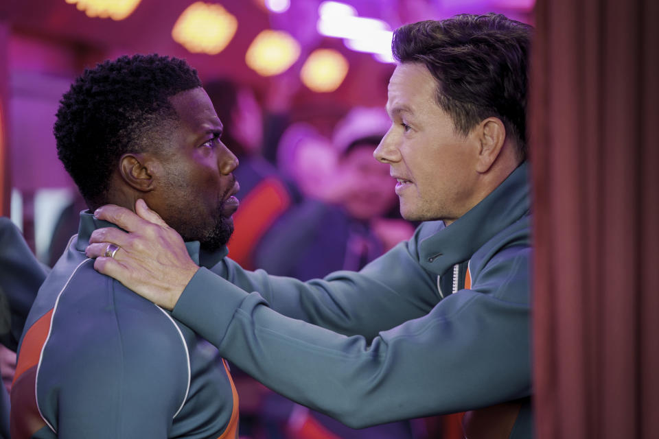 This image released by Netflix shows Kevin Hart, left, and Mark Wahlberg in "Me Time." (Saeed Adyani/Netflix via AP)