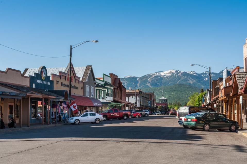 the main street with twons and cars in whitefish montana