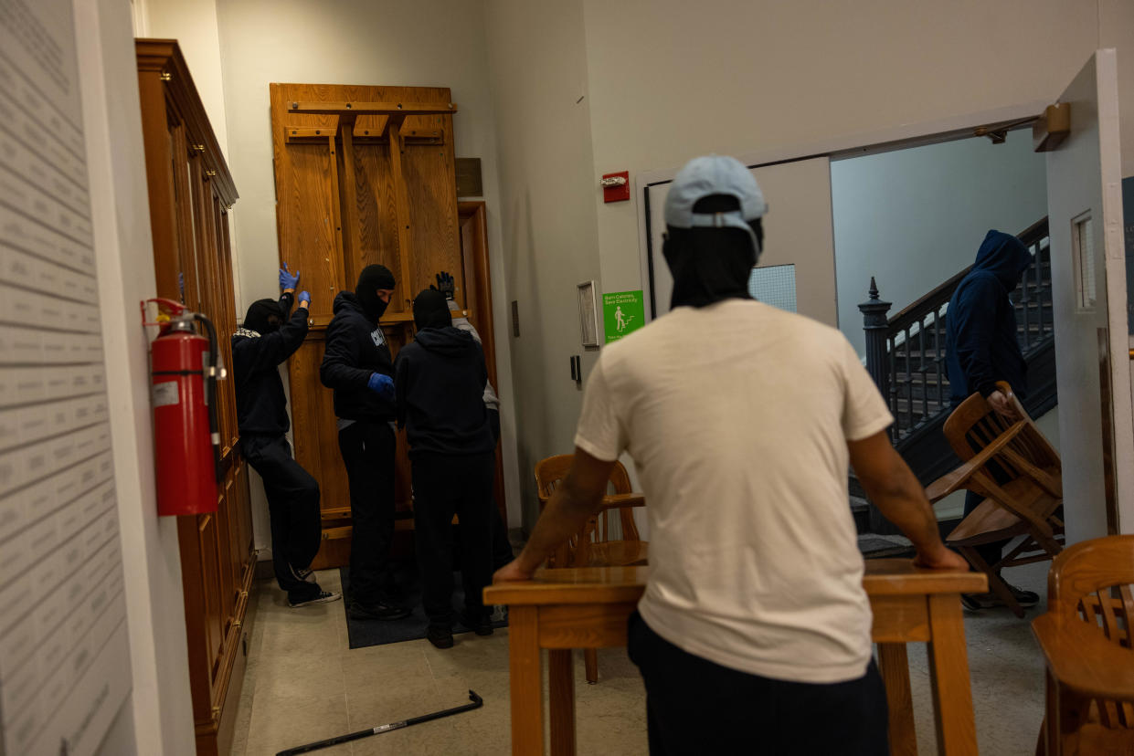 Demonstrators from the pro-Palestine encampment on Columbia's Campus barricade themselves inside Hamilton Hall, where the office of the Dean is located on Tuesday, April 30, 2024 in New York City.