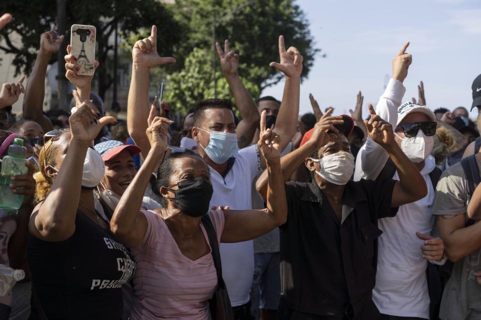 Anti-government protesters march in Havana, Cuba, Sunday, July 11, 2021. As Cubans facing the country's worst economic crisis in decades took to the streets in droves over the weekend into Monday, July 12, 2021, authorities blocked social media sites in an apparent effort to stop the flow of information into, out of and within the beleaguered nation. (AP Photo/Eliana Aponte, file)