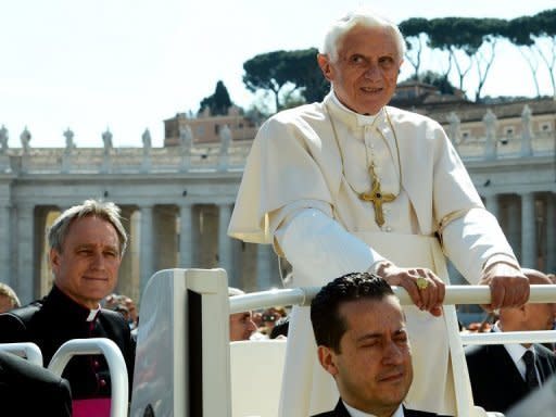 Paolo Gabriele (bottom), the pope's butler, sits in the popemobile next to Pope Benedict XVI in April 2012. The Vatican confirmed Saturday that Pope Benedict XVI's butler had been arrested on suspicion of leaking confidential documents and letters from the pontiff's private study to newspapers