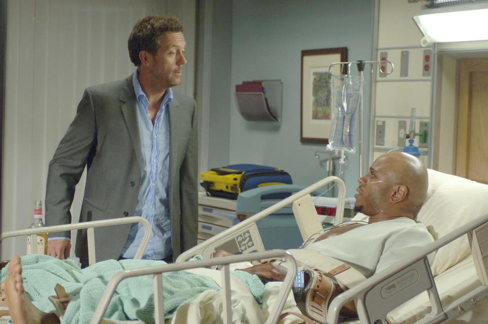 In this image released by Fox, Hugh Laurie portrays Dr. Gregory House, left, and LL Cool J portrays a sick death row inmate in a scene from "House, M.D." The Fox medical drama concludes its eight-season run on Monday, May 21, 2012, with a finale at 9 p.m. EDT, preceded by a one-hour retrospective. (AP Photo/Fox, Jaimie Trueblood)