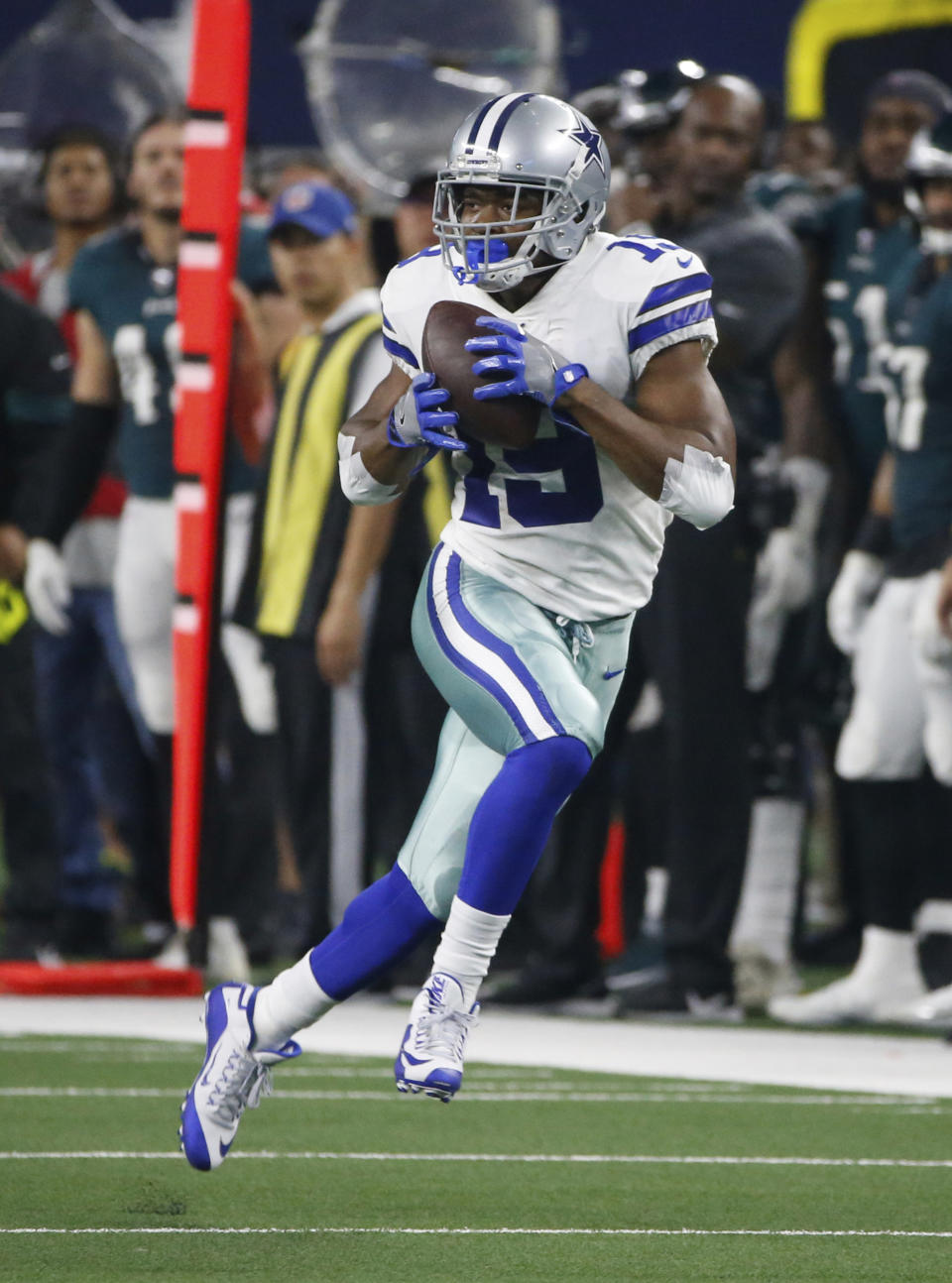 Dallas Cowboys wide receiver Amari Cooper (19) catches a long pass in the first half of an NFL football game against the Philadelphia Eagles in Arlington, Texas, Sunday, Oct. 20, 2019. (AP Photo/Ron Jenkins)