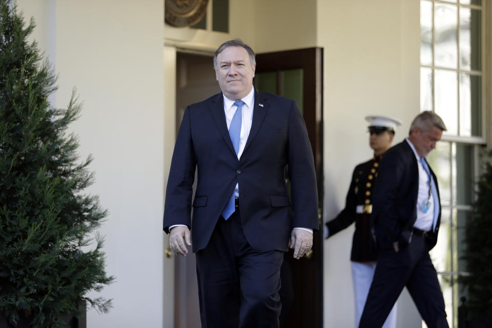 Secretary of State Mike Pompeo walks out of the White House to talk to the media after briefing President Donald Trump in the Oval Office, Thursday, Oct. 18, 2018, in Washington. (AP Photo/Evan Vucci)